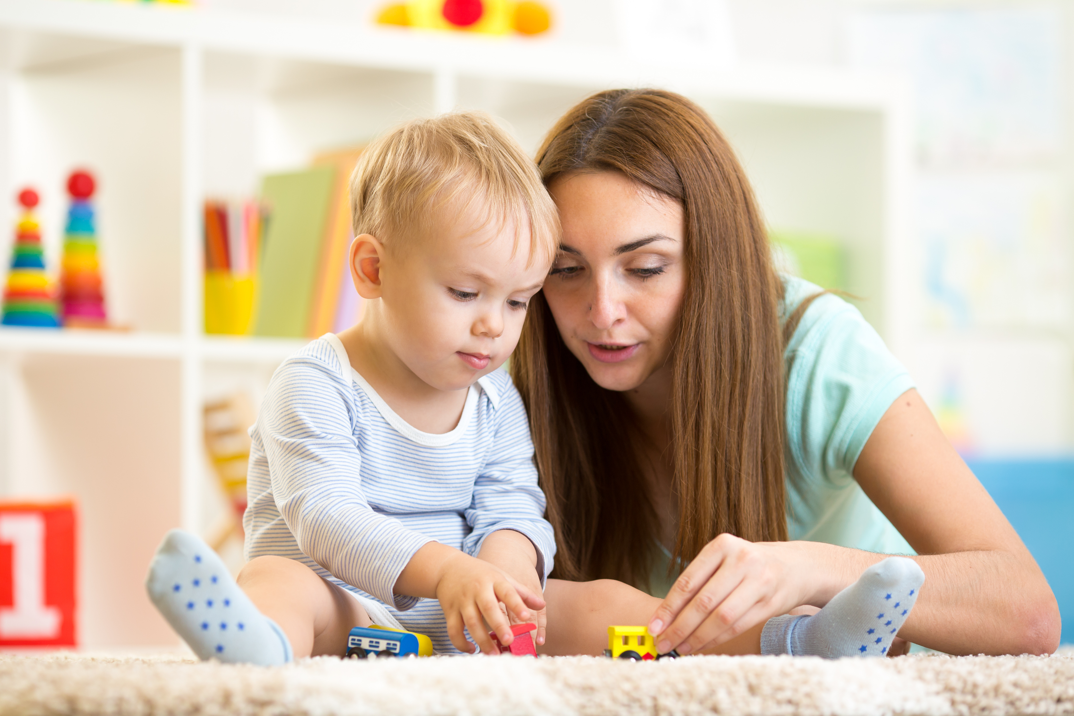 baby and mom playing