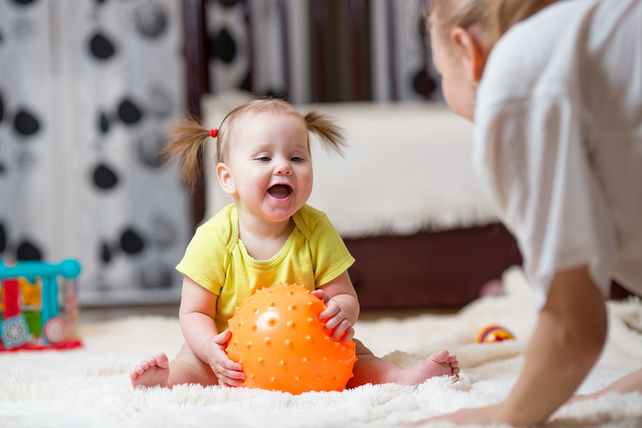 baby playing with ball