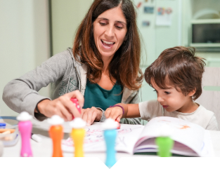 Toddler coloring with mother